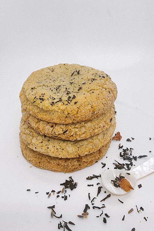 Stack of three earl grey tea cookie infused with vanilla, rose, sunflower, and hibiscus.