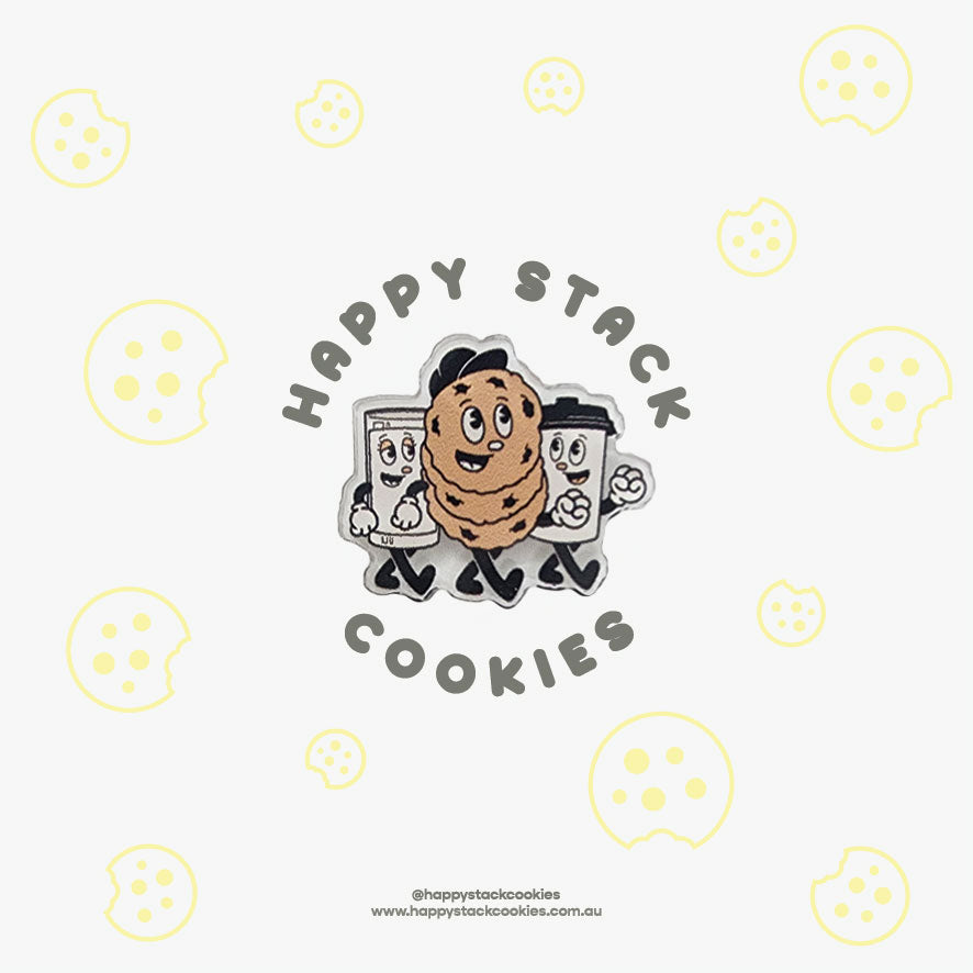 Happy Stack Cookies acrylic pin on a packaging card filled with cookies and the logo.