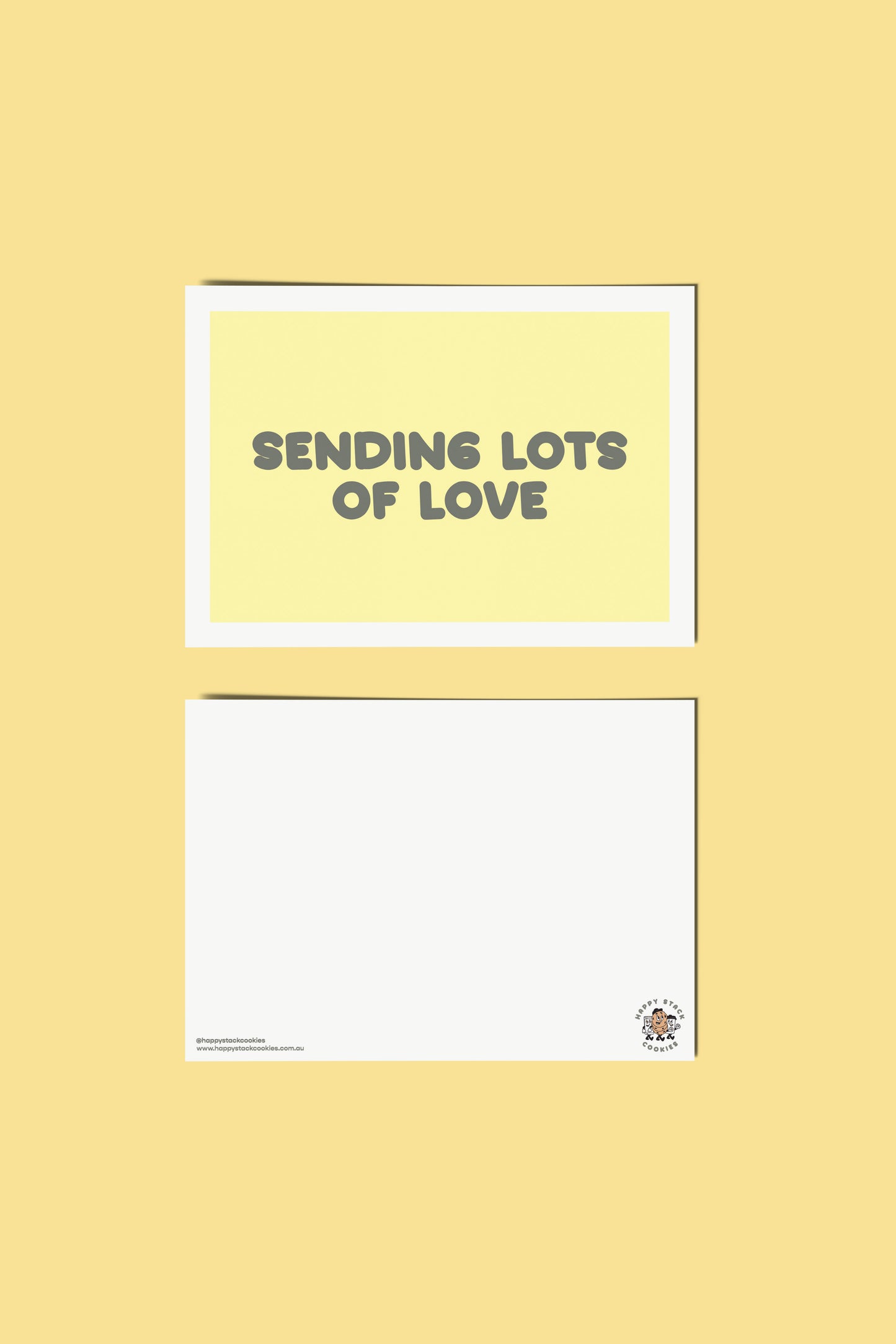 Happy Stack Cookies sending lots of love card showing front and back side on a yellow background.